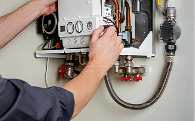 Professional technician working on a boiler installation in Aylesbury.
